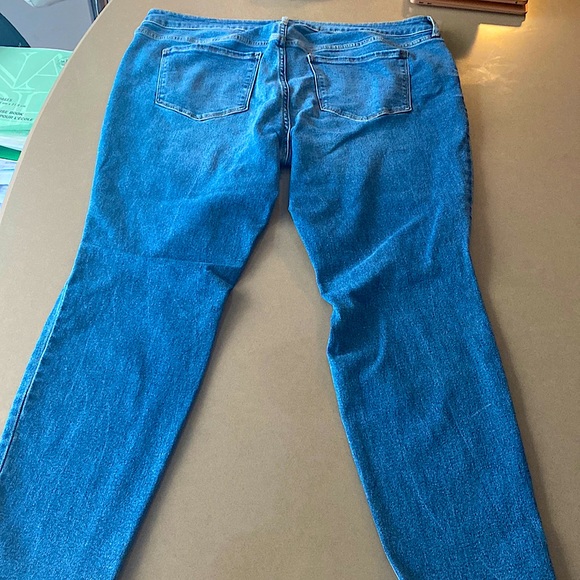 Low-rise skinny rockstar blue jeans with rips at the knees. - Picture 2 of 3
